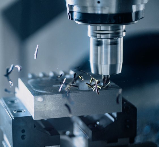CNC milling machine working on precision metal parts